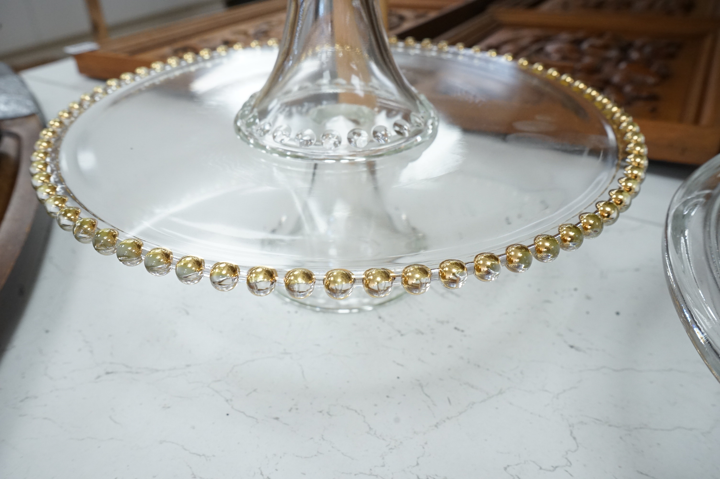 Seven decorative 20th century glass cake tazza, largest 36cm diameter